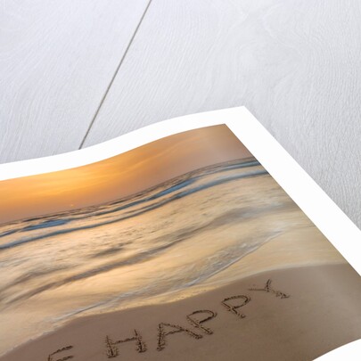 Sand writing on beach by Assaf Frank